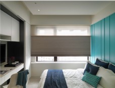 现代时尚卧室亮蓝绿色背景墙室内装修效果图